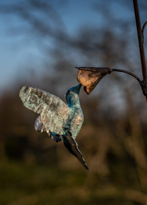 Bloem brons steel aan steeltje van rvs met ijzer